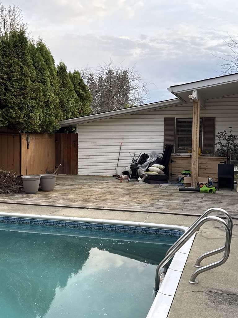 Poolside deck before Max refreshed it