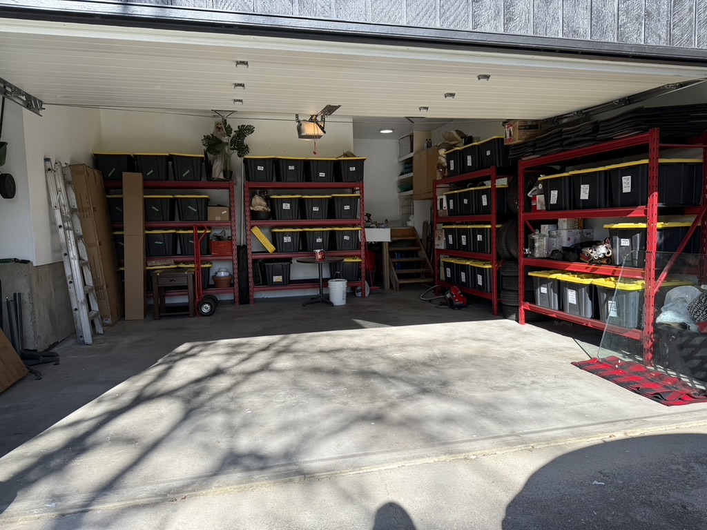 Garage after Max added organized shelving and storage